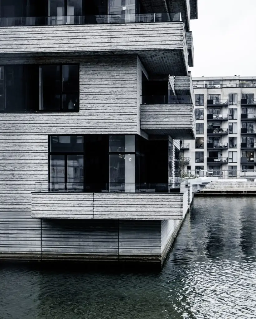 Cantilevered Apartments, Copenhagen Cantilevered timber-clad apartments above the water, Copenhagen, black and white