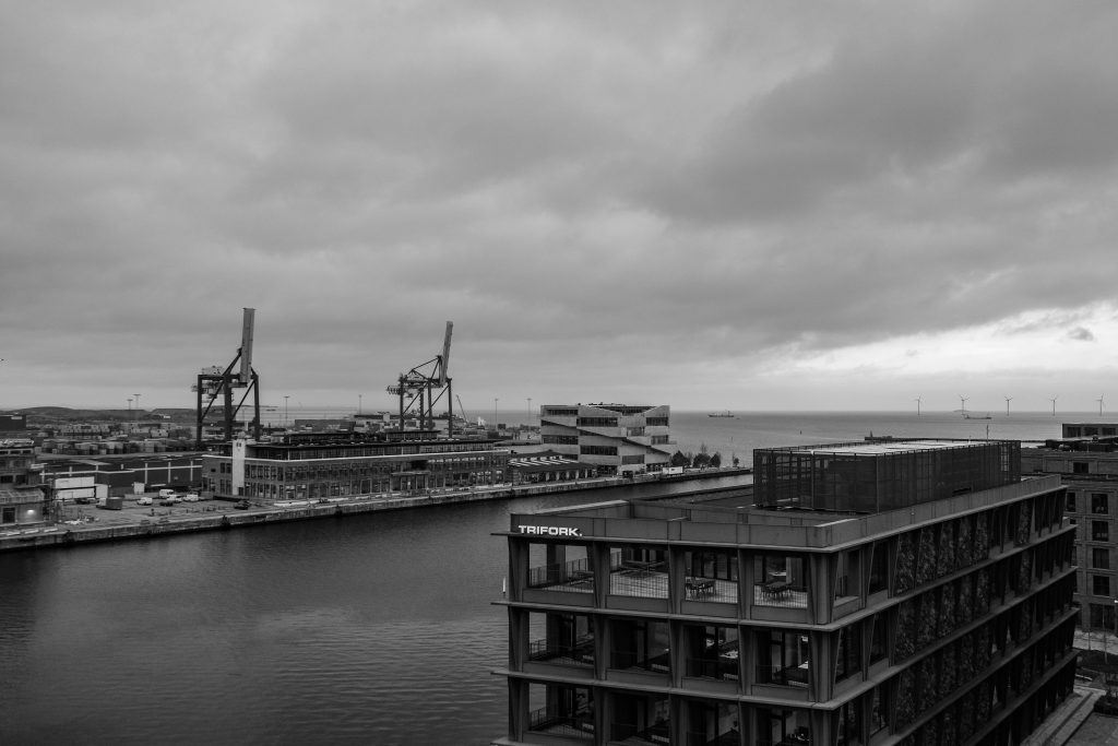 Harbour Cranes, Copenhagen Copenhagen harbour with cranes beyond a modern apartment block, black and white