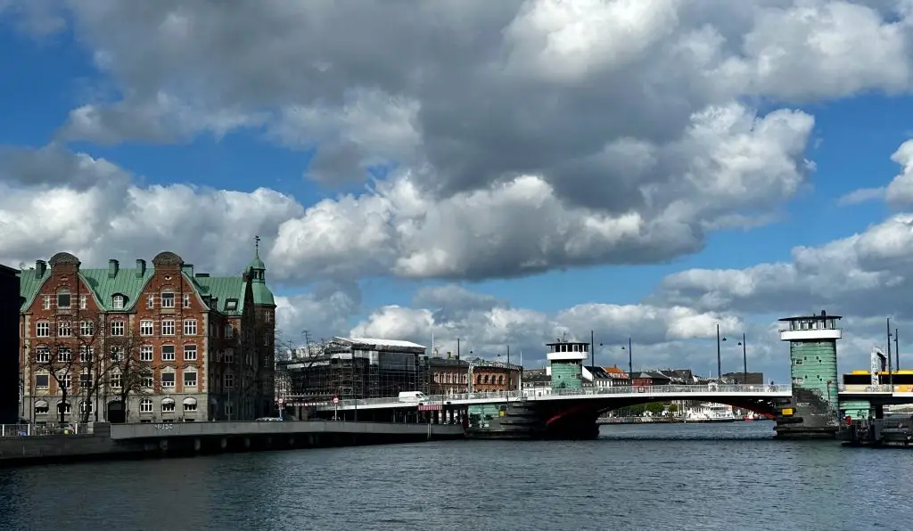 Harbour Panorama, Copenhagen Wide harbour view with historic brick buildings, a bridge and dramatic clouds, Copenhagen