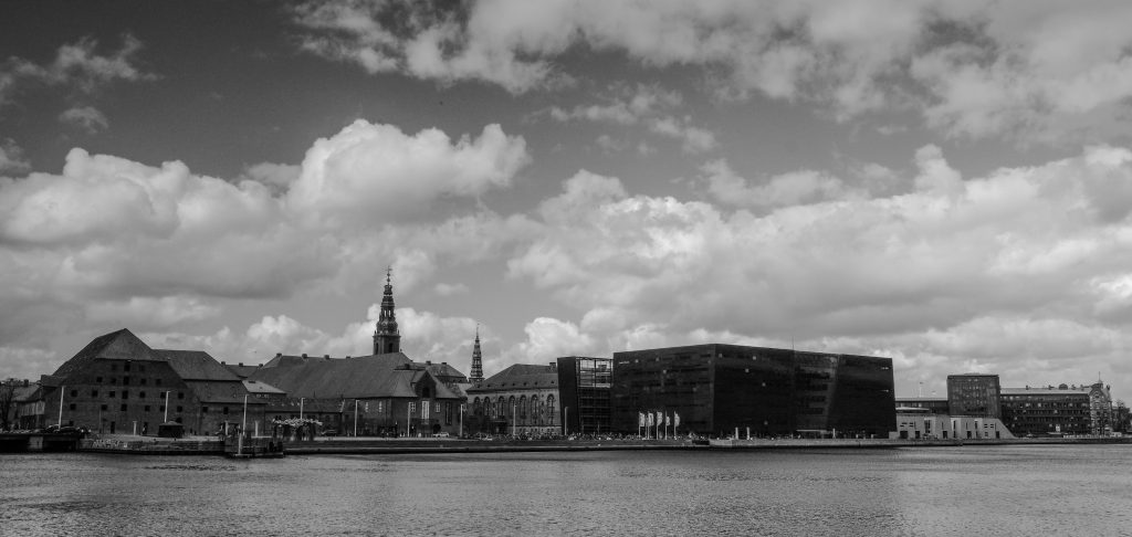 Harbour Skyline Copenhagen harbour skyline with church spires under dramatic clouds, black and white panorama