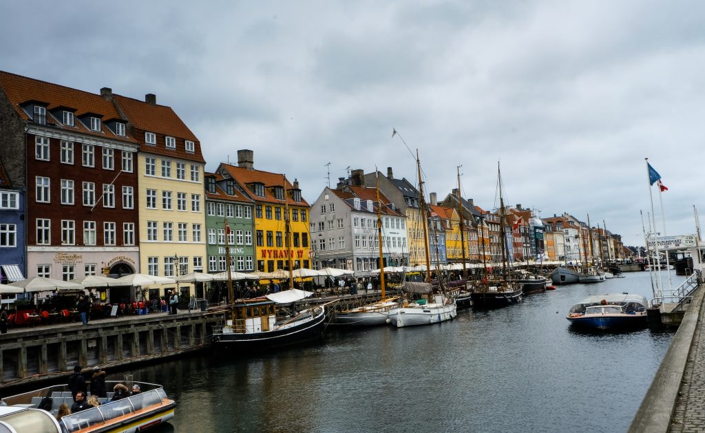 Nyhavn Colourful historic townhouses and boats along the Nyhavn canal, Copenhagen