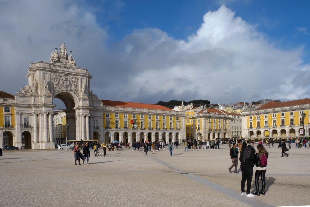 Wide view of Pra&ccedil;a do Com&eacute;rcio and the Rua Augusta Arch under dramatic clouds, Lisbon