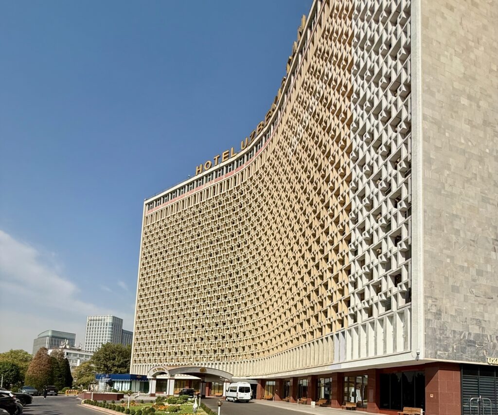 Curved honeycomb facade of the iconic Soviet-era Hotel Uzbekistan in Tashkent