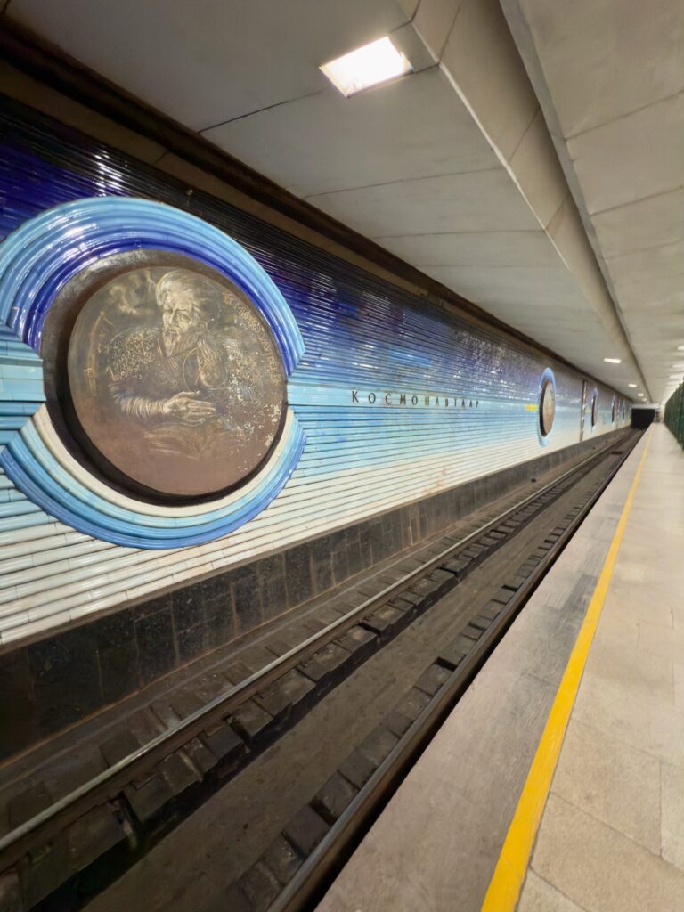 Decorative mosaic medallion portrait on a Tashkent metro station wall