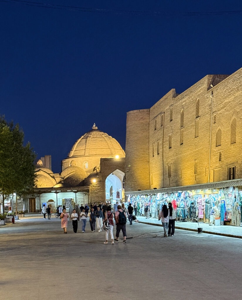 Night view of an illuminated courtyard complex, Bukhara, Uzbekistan