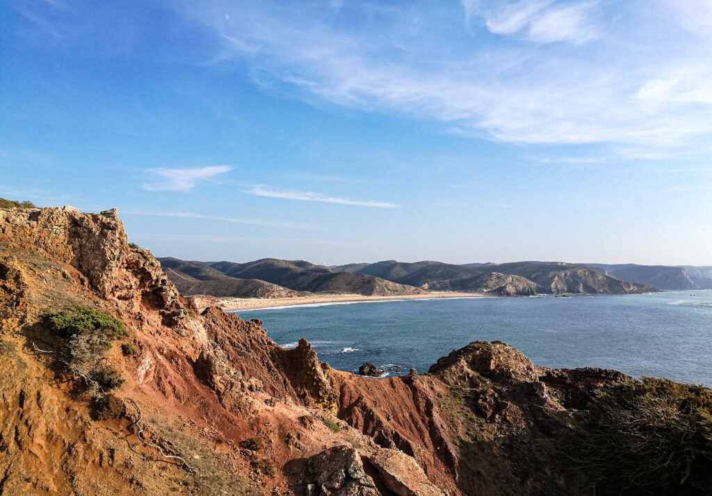 red cliffs above the Atlantic Ocean in Portugal with wide blue sky &ndash; fine art landscape print