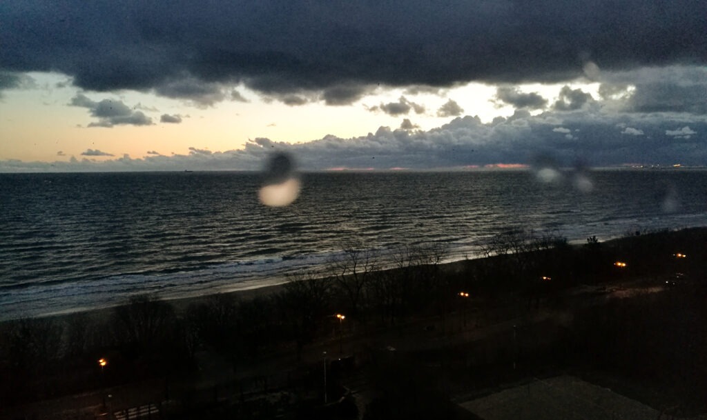 dark storm clouds over the Baltic Sea with glowing horizon &ndash; dramatic fine art seascape