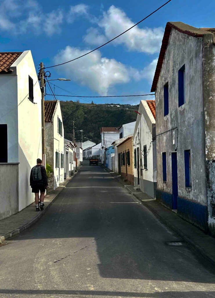 Quiet village street with white houses and blue trim, Azores