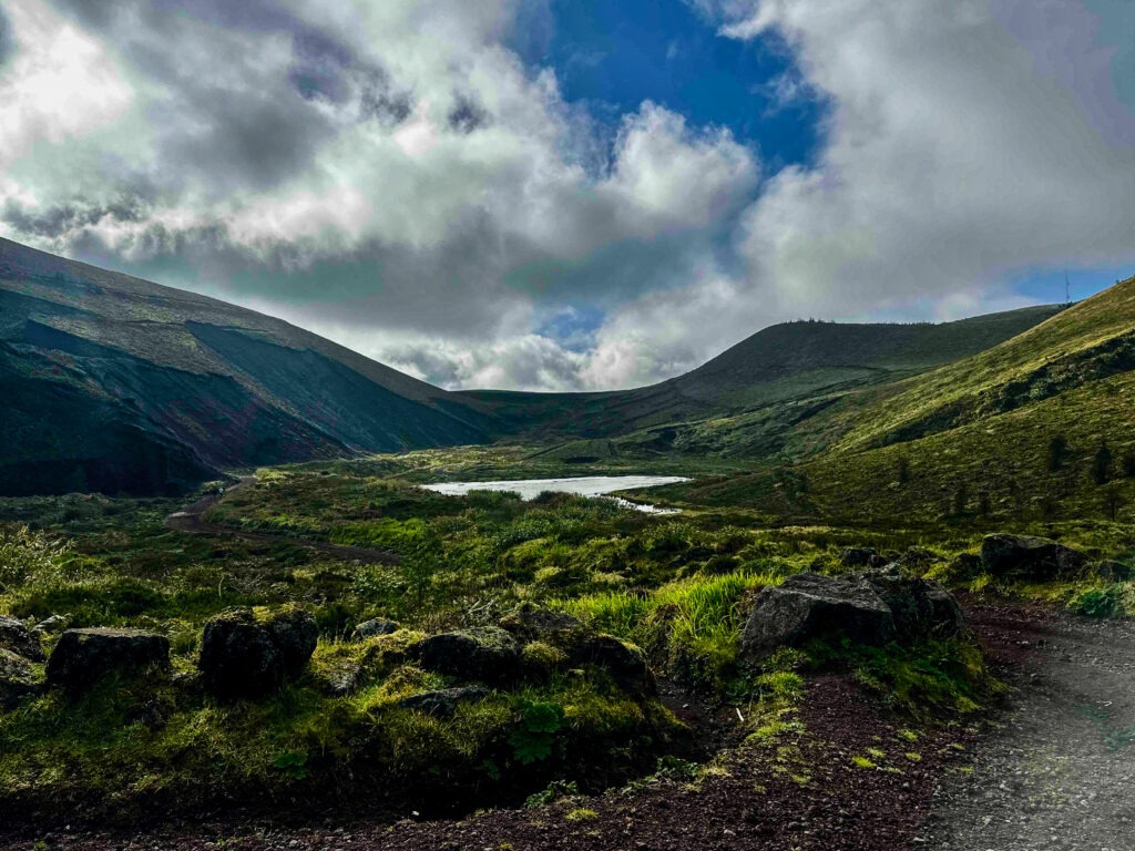 Green volcanic valley and lake in the Azores landscape