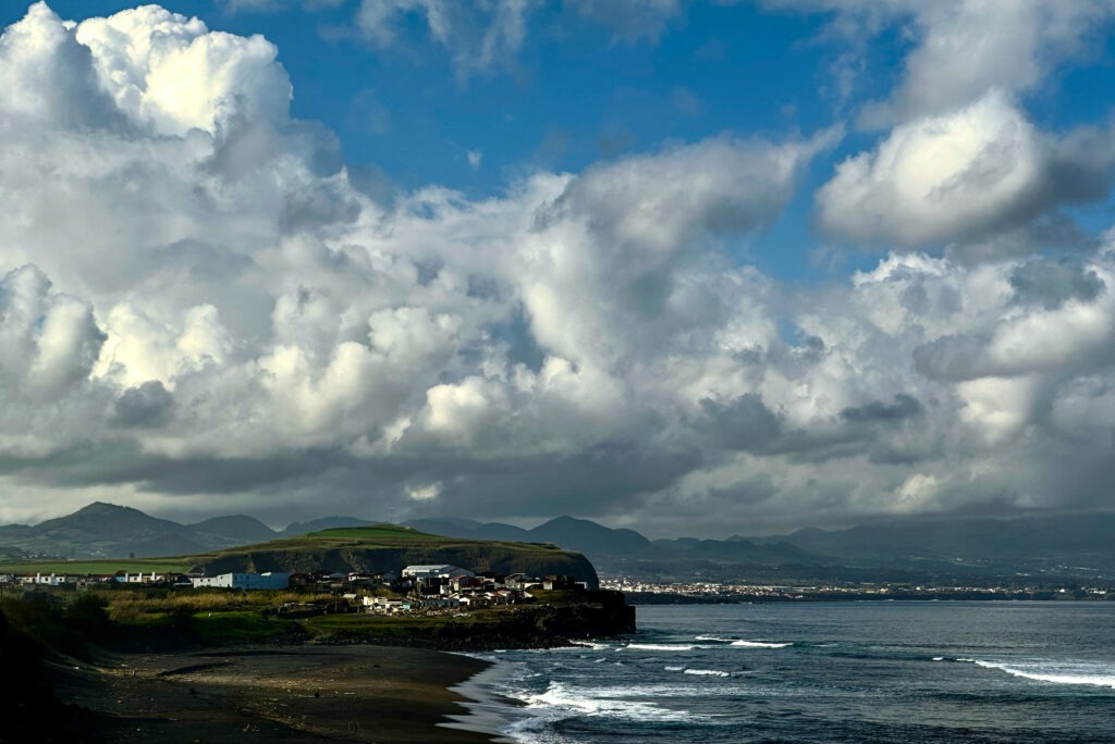 Atlantic waves and clouds meeting the coastline of the Azores under a dramatic sky, fine art seascape